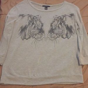 A long sleeved grey shirt with two tigers